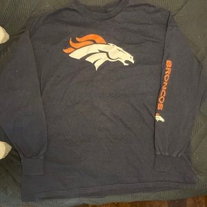 A 3 XL long sleeve bronco shirt with a logo on the front.
